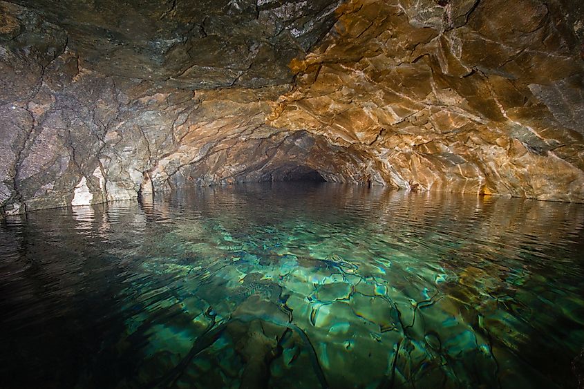 An underground cave flooded with water.