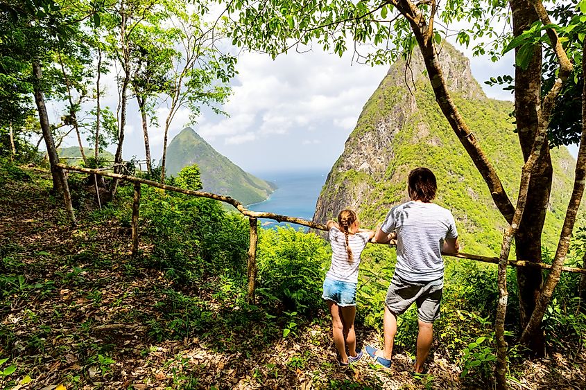 A pair enjoying the scenery of the Piton mountains on St Lucia. Source: Shutterstock/BlueOrange Studio