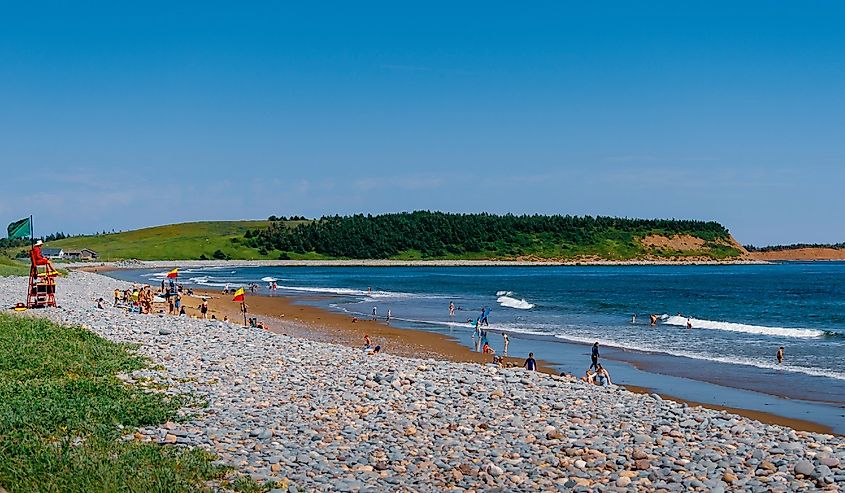 Lifeguard overlooks swimmers at Lawrencetown Beach, Nova Scotia