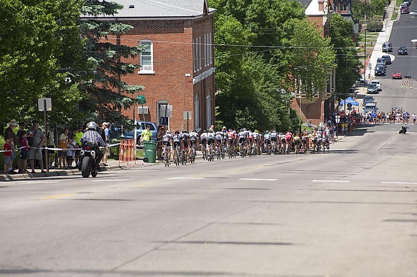 Cyclists descending steep hill in downtown Stillwater, Minnesota.