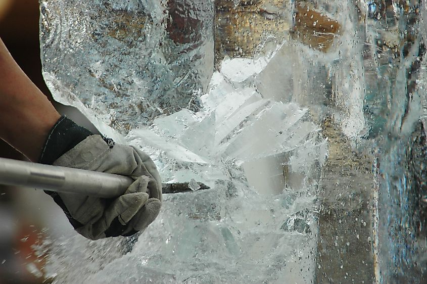 A man carves a block of ice