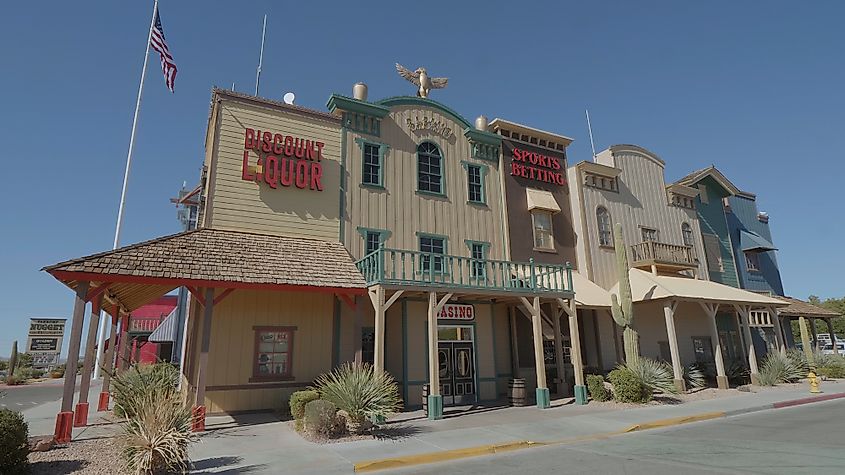 Historic saloon building and casino in Pahrump, Nevada, featuring classic Western architecture with neon signs and a rustic facade.