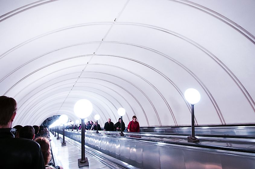 People on Europe's longest escalator at Park Pobedy Metro station