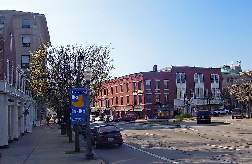 View along Broad Street (US 1) in Westerly, Rhode Island, featuring historic buildings and storefronts that are part of the Westerly Downtown Historic District. 