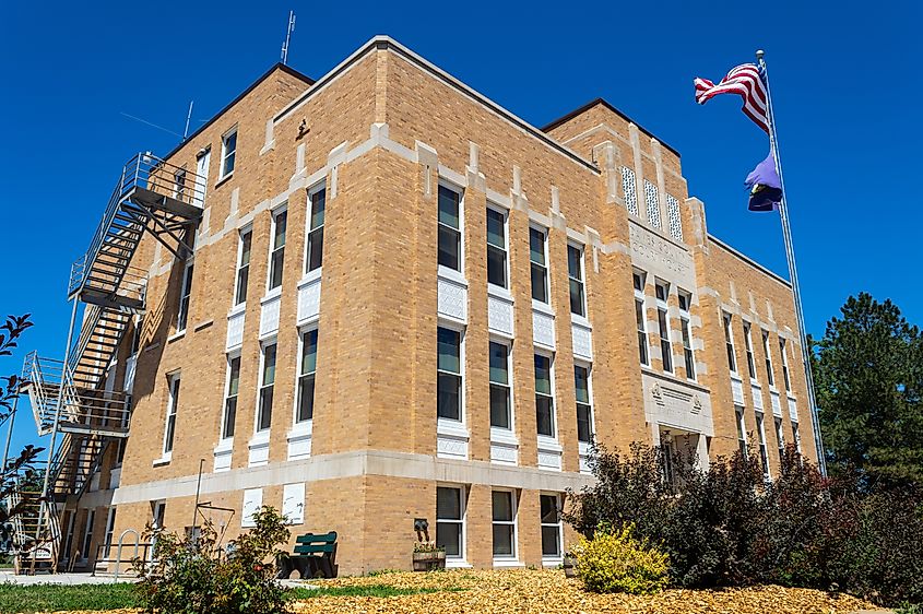 The Flag Flies in Front of the Dawes County Courthouse in Chadron, NE. Editorial credit: davidrh / Shutterstock.com