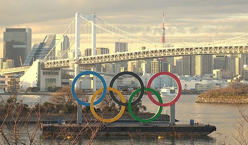 The five ring symbol of the Olympic Games in front of Odaiba Rainbow Bridge. Japan will host the Tokyo 2020 summer Olympic and Paralympic. Shot in sunset time.