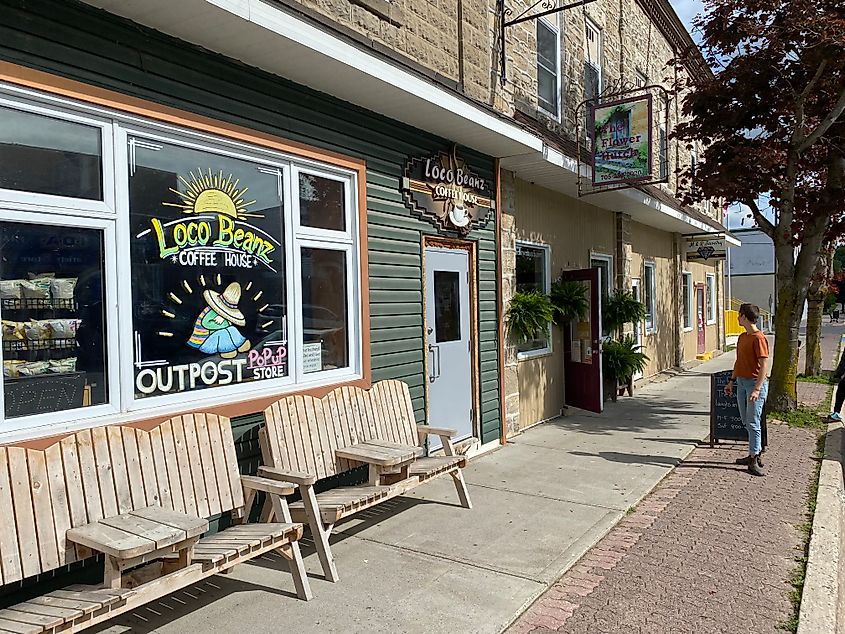 A small town strip with a coffee shop and flower shop side by side