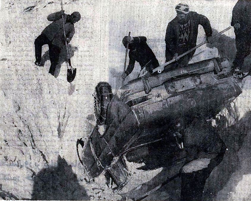 People helping a crashed car during 1972 Iran blizzard.