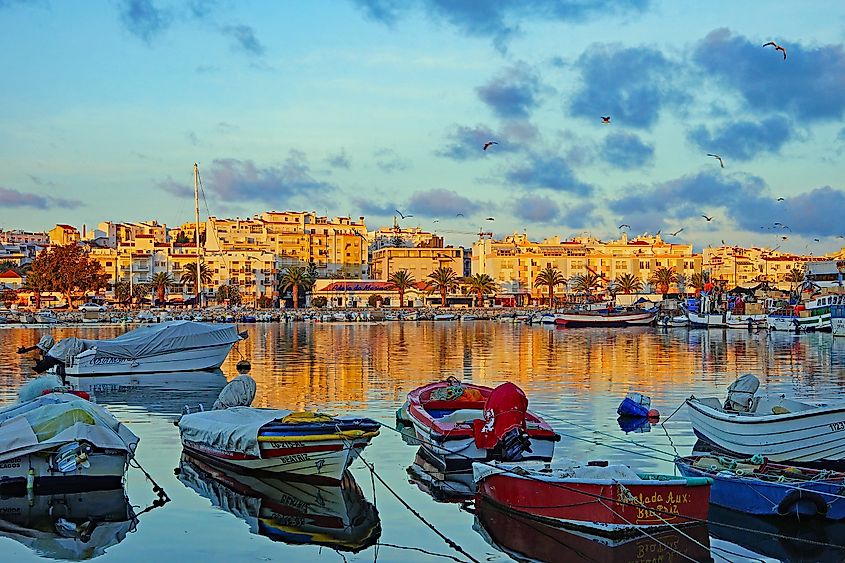 Fishing boats in the historic harbor of Lagos, Algarve, Portugal