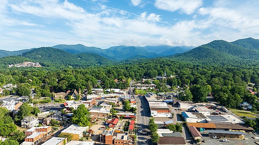 Aerial view of Black Mountain, NC, showcasing a charming town surrounded by lush green forests and mountainous landscape