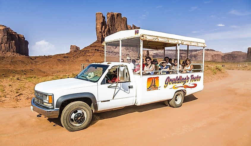 People enjoy the ride through the scenic Buttes in the Monument Valley.