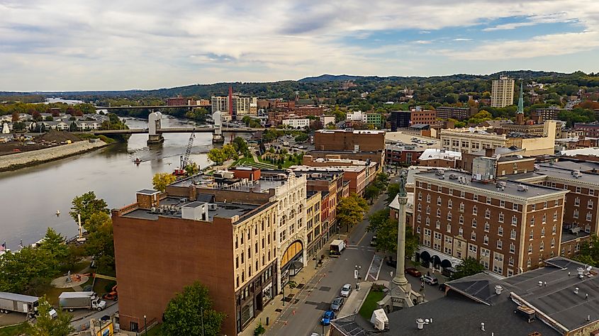 Tugboat and Downtown Troy, New York in Rensselaer County along the banks of the Hudson River