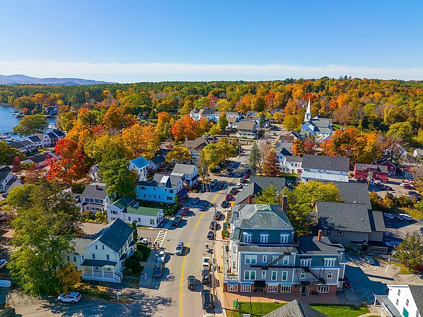 Aerial view of Wolfeboro's historic town center along Main Street, located on Lake Winnipesaukee, showcasing vibrant fall colors in the town of Wolfeboro, New Hampshire.