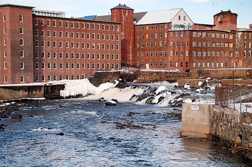 The historic brick pepperell center or former mill building in the town of Biddeford Maine on the Saco River.