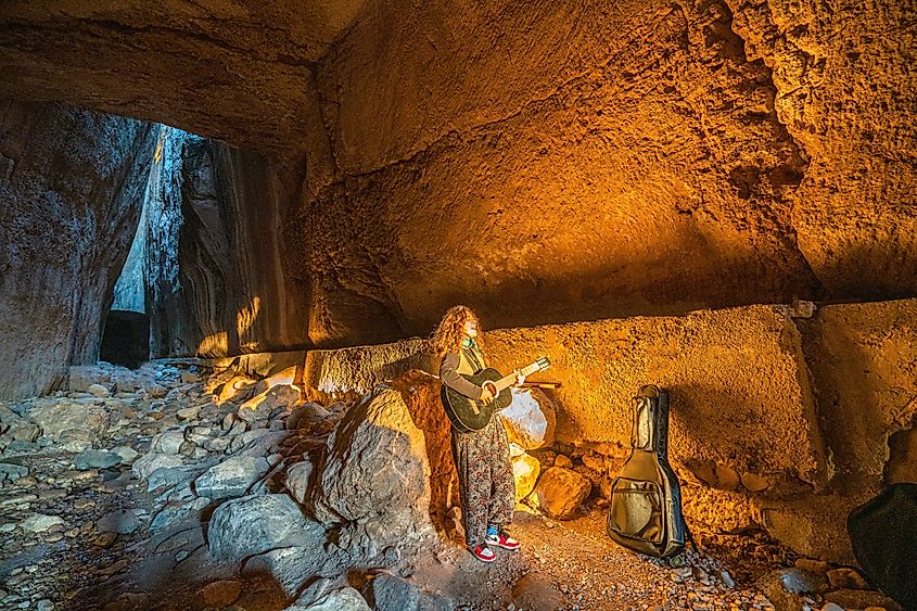 A guitar player performing in the Vespasianus Titus Tunnel. Image by Selcuk Oner via Shutterstock.jpg