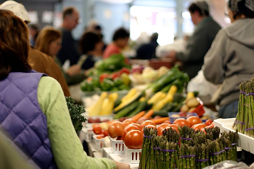 A crowd shops for fresh produce in an open marketplace. Taken at Detroit's Eastern Market.