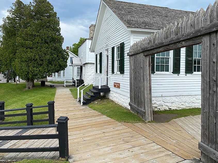 The restored buildings, white-painted, of Fort Mackinac. A boardwalk connects them 