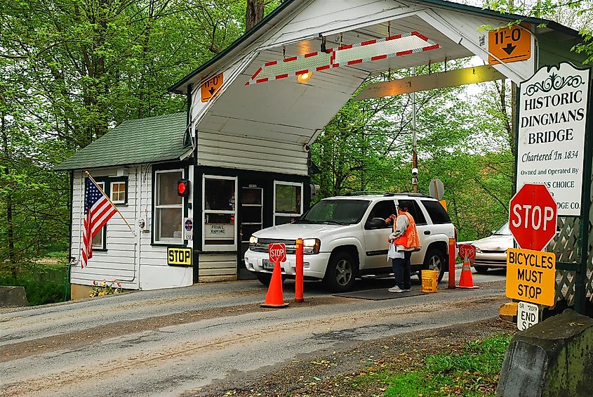 A car stops at a toll booth on the Dingman Ferry Bridge in Dingmans Ferry, New Jersey, USA.