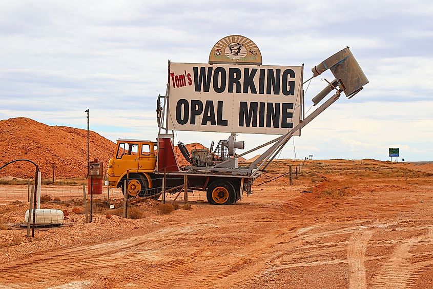 Blower truck holding the entrance sign to Tom's Working Opal Mine on Stuart Highway in Coober Pedy.