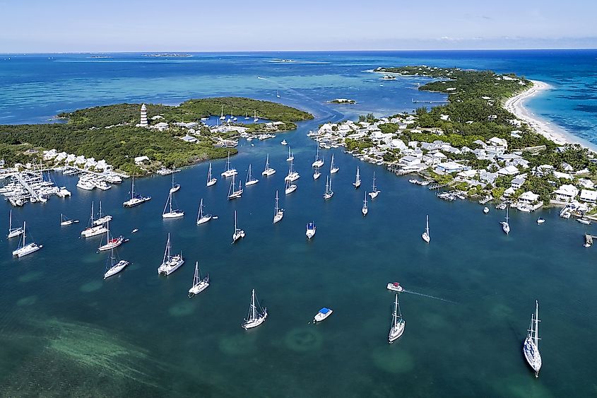 Aerial view of the harbor and lighthouse in Hope Town on Elbow Cay off the island of Abaco, Bahamas. Image credit: pics721/Shutterstock.com