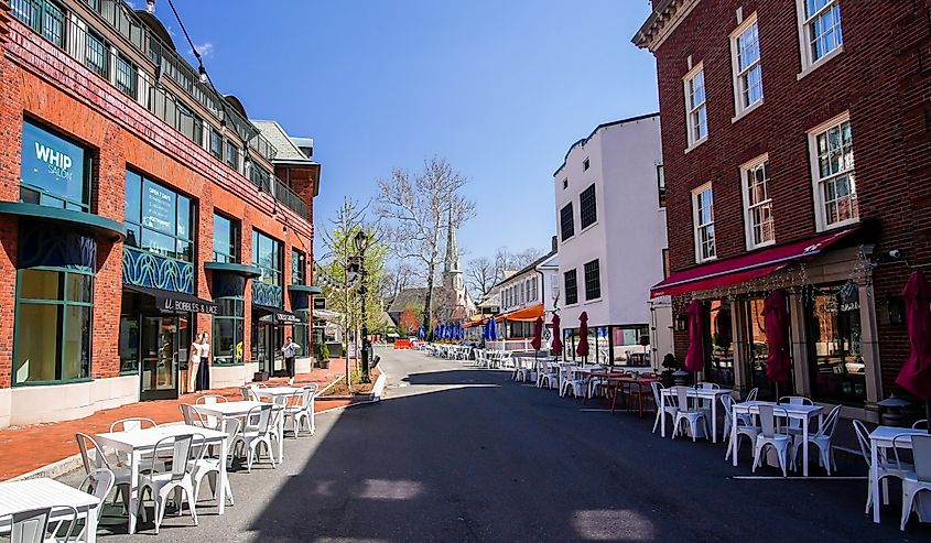 View from Church Lane in beautiful spring day with restaurants table outside in Westport