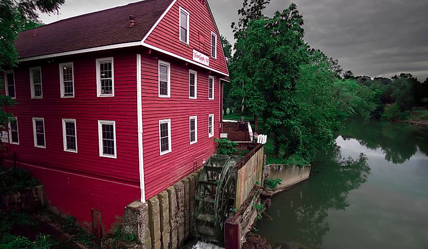 Historic War Eagle Mill on War Eagle River on cloudy morning