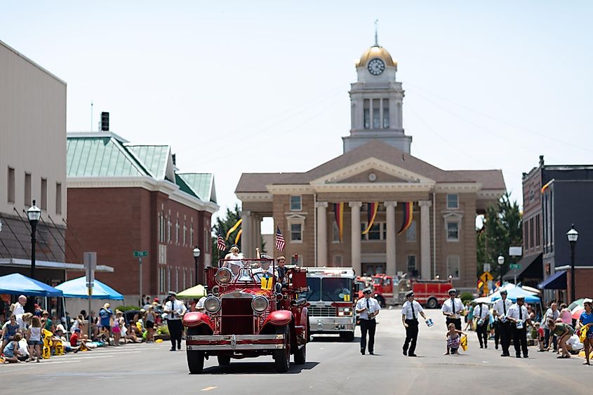 People in a parade in Jasper, Indiana. Image credit Roberto Galan via Shutterstock