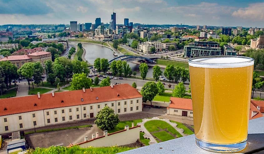 Glass of light beer with view from above of Vilnius, Lithuania