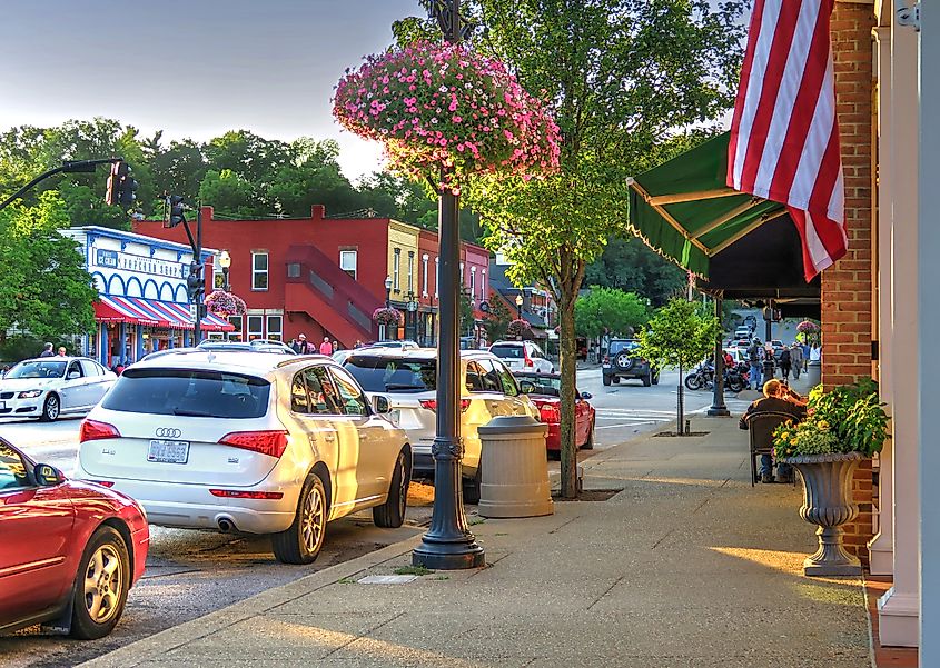 Main Street near Bell Street in downtown Chagrin Falls, Ohio, looking toward the Popcorn Shop and Starbucks on a summer evening during the golden hour.