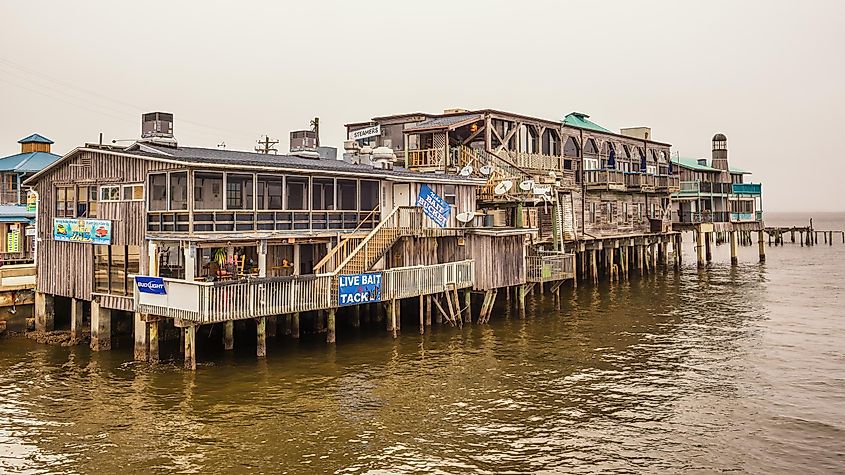 Waterfront buildings on stilts in historic downtown Cedar Key, via Nick Fox/Shutterstock.com