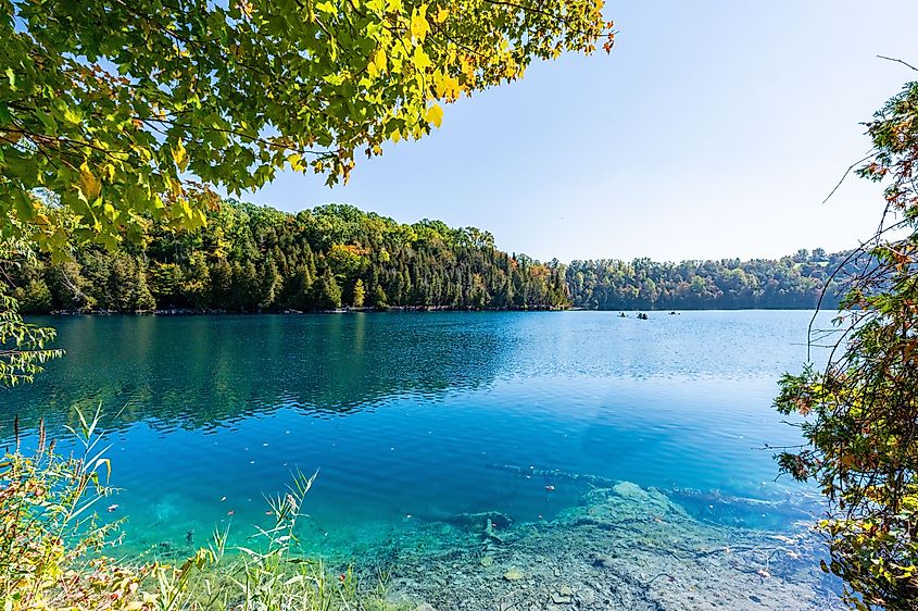 Green Lakes State Park in Syracuse, New York, offers emerald lakes and picturesque trails, making it a perfect destination for outdoor enthusiasts and nature admirers.