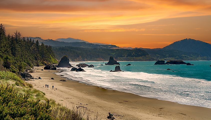 Sunrise at the beach with sea stacks at Battle Rock Wayside in Port Orford, Oregon.