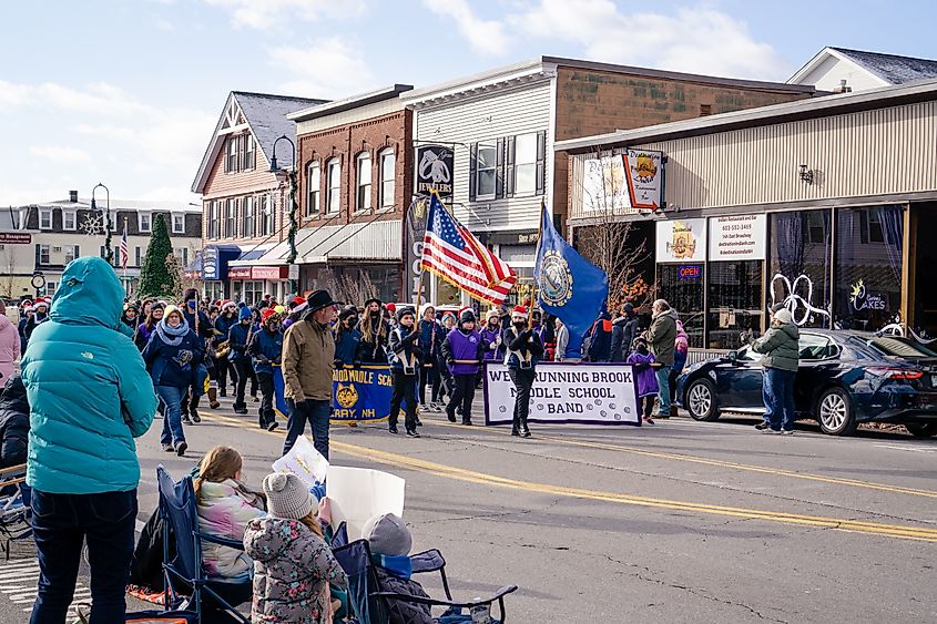 People celebrating the Annual Nutfield Holiday Parade in Derry, New Hampshire.