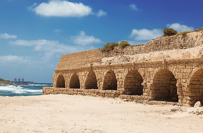 Ruins of an ancient Roman aqueduct in Caesarea National Park in Israel