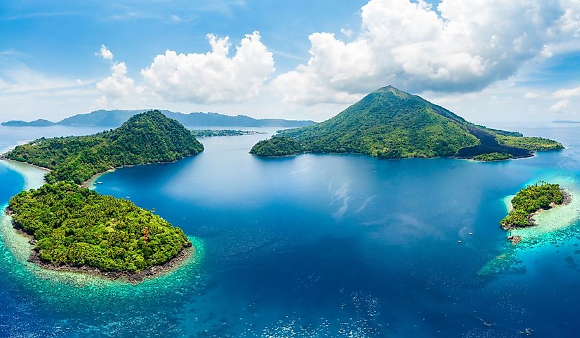 Aerial view Banda Islands Moluccas archipelago Indonesia, Pulau Gunung Api, lava flows, coral reef white sand beach.