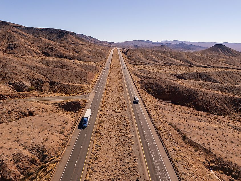 Aerial view of U.S. 93 in Arizona crossing a desert landscape with hills and mountains