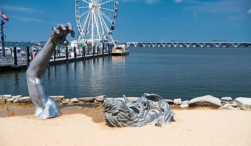 Ferris wheel and yacht marina pier on the Potomac River in National Harbor, Maryland.