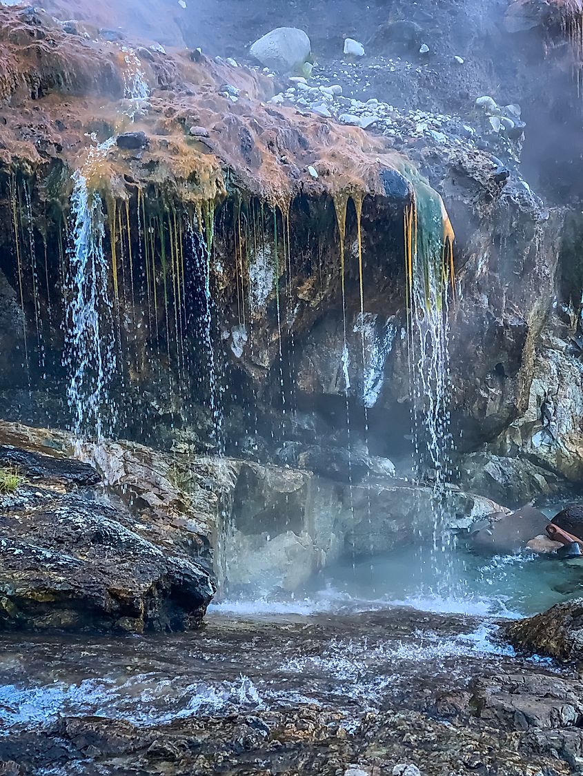 Kirkham Hot Springs in Idaho, with natural pools surrounded by rocky terrain and lush greenery