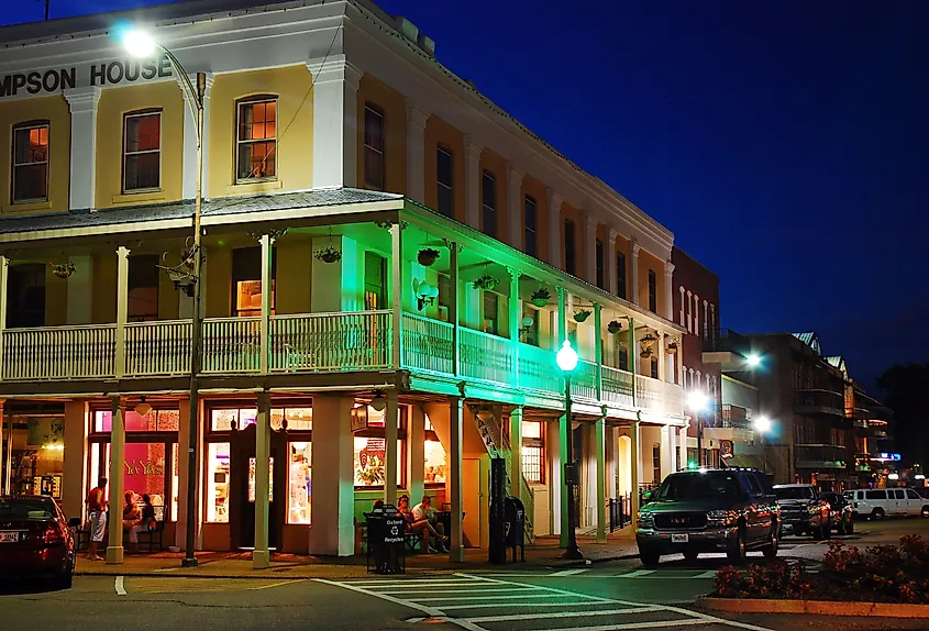 The lights of the stores in downtown Oxford, Mississippi begin to glow at twilight.