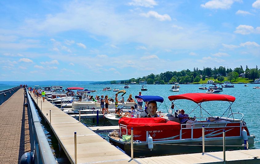 Pier with luxury boats docked in Skaneateles Lake