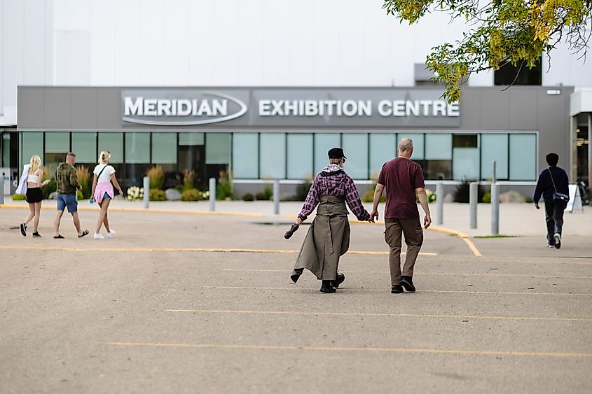 People walk toward the Winkler Harvest Festival.