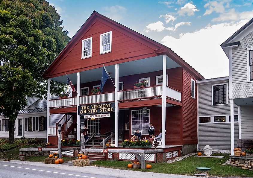 Tourists outside the historic family owned red wooden Vermont Country Store in the quaint village of Weston. Editorial credit: Brian Logan Photography / Shutterstock.com