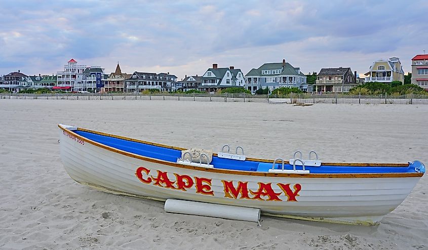 Boat with a Cape May sign on the beach in Cape May, New Jersey