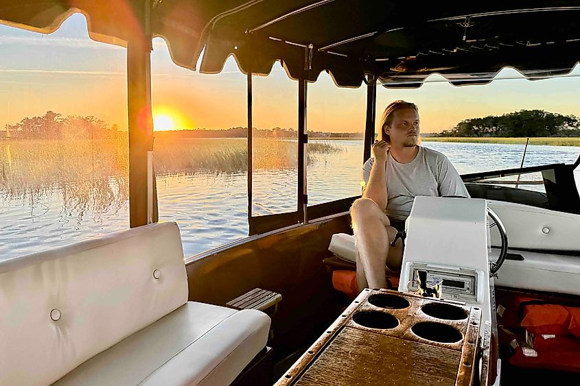Captain Scott on the Twelve Volt Lady eco cruise at sunset Image credit Bryan Dearsley