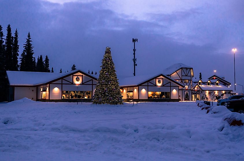 North Pole, Alaska, USA - December 10th, 2020: Beautiful Christmas Tree and Santa Claus House in winter holiday season