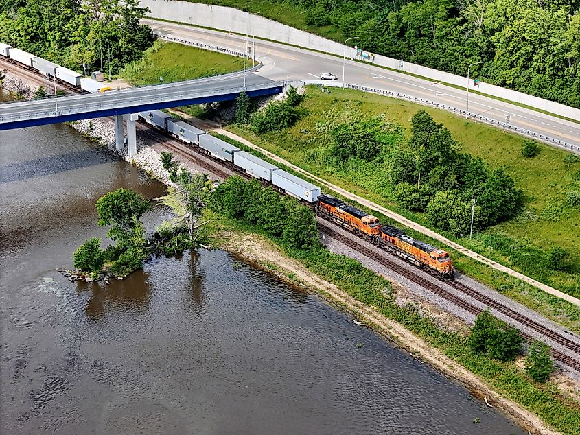 Aerial view of a freight train passing under the Dale Gardner Veterans Memorial Bridge at Savanna, Illinois.