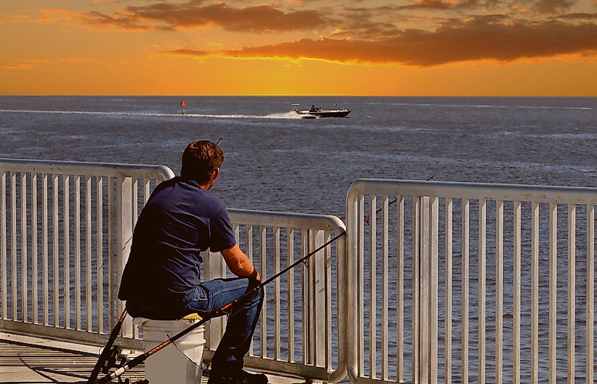 An angler fishing in the sea at Cedar Key, Florida.