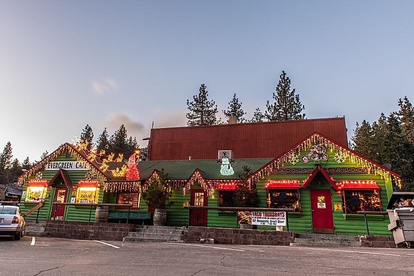 Evergreen Cafe and Raccoon Saloon decorated with Christmas holiday lights on Evergreen Road in Wrightwood, California