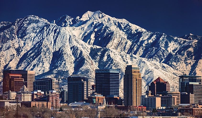 A record-breaking snowpack in the Wasatch Mountains behind the downtown Salt Lake City skyline, Utah.