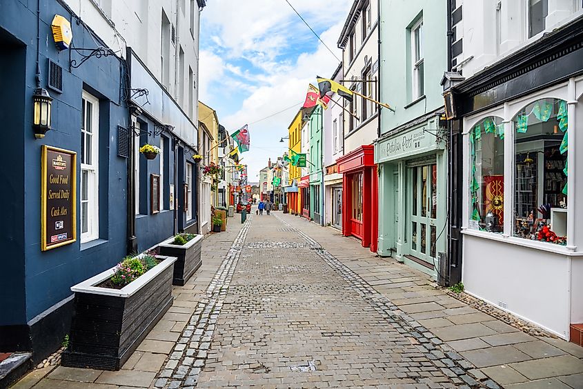 People walking along Palace Street in the old town of Caernarfon, Wales, United Kingdom